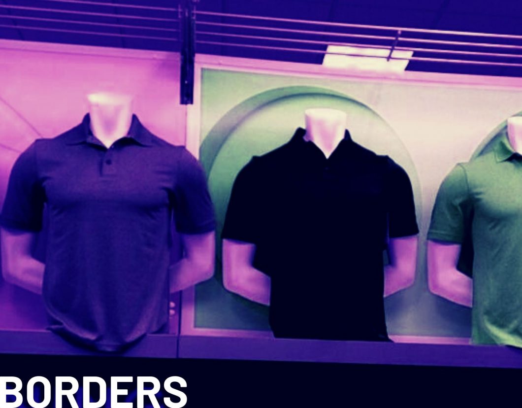 mannequins wearing polo shirts in a store display